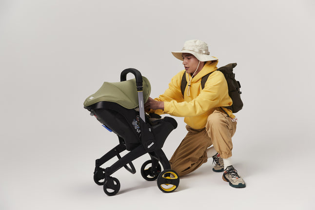 Doona Omvormbare draagbare autostoel Infant Desert Green Groep 0+