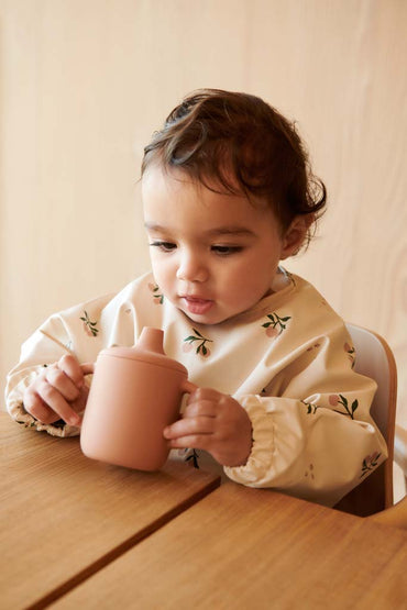 Liewood Slabbetje met mouwen Merle Peach Multicolor