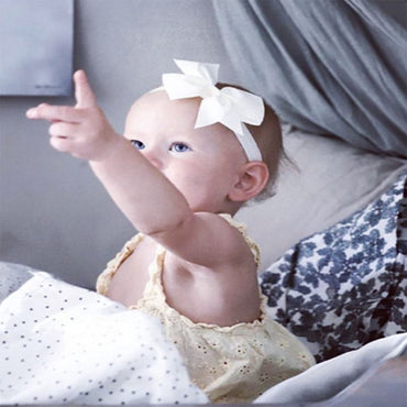 Busy Lizzie Bandeau avec nœud blanc