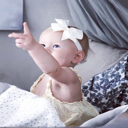 Busy Lizzie Bandeau avec nœud blanc